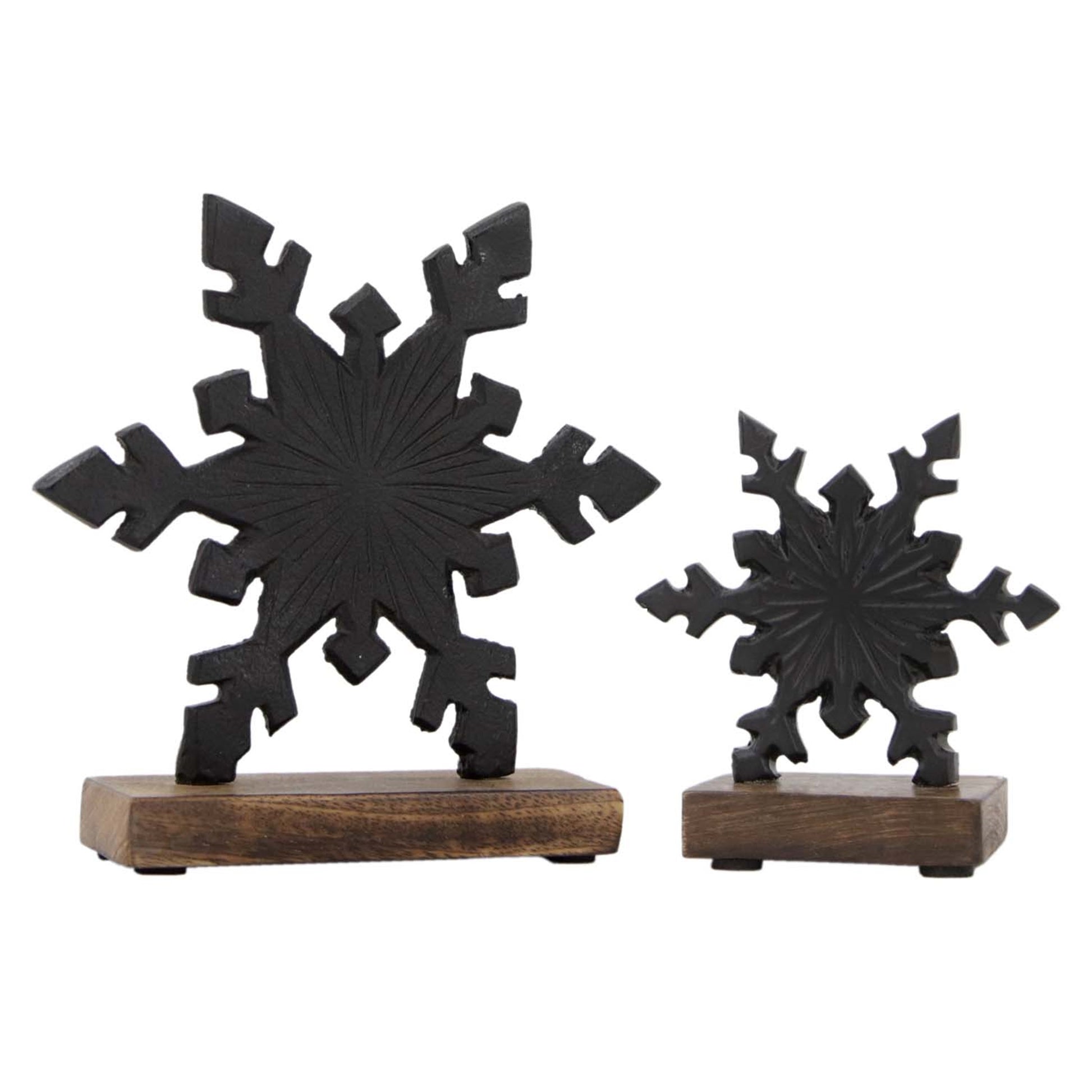 Two black snowflake-shaped objects on wooden bases against a white background